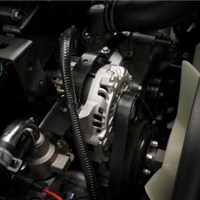 A vehicle alternator under the hood.