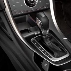 A gear stick inside a vehicle.